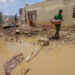 People save things from a destroyed house following heavy rains in Abu Hamad, in Sudan's River Nile state, some 400 kilometres (nearly 250 miles) north of Khartoum, on August 9, 2024. Heavy rains have triggered building collapses that have killed 17 people in northern Sudan, as the country reels from almost 16 months of fighting between rival security forces, a medic told AFP. (Photo by AFP) (Photo by -/AFP via Getty Images)